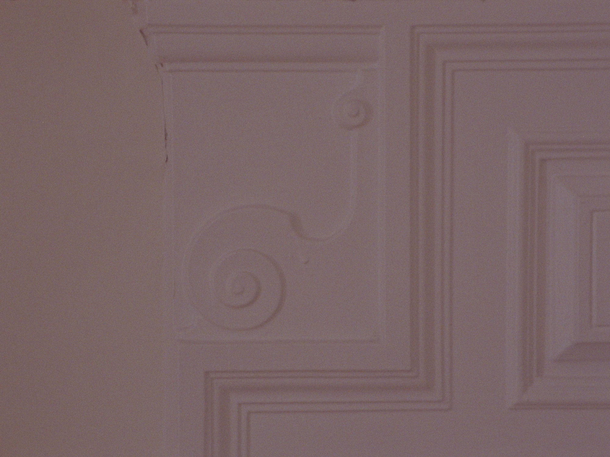 16mm film still: mouldings on a fireplace in Glasgow