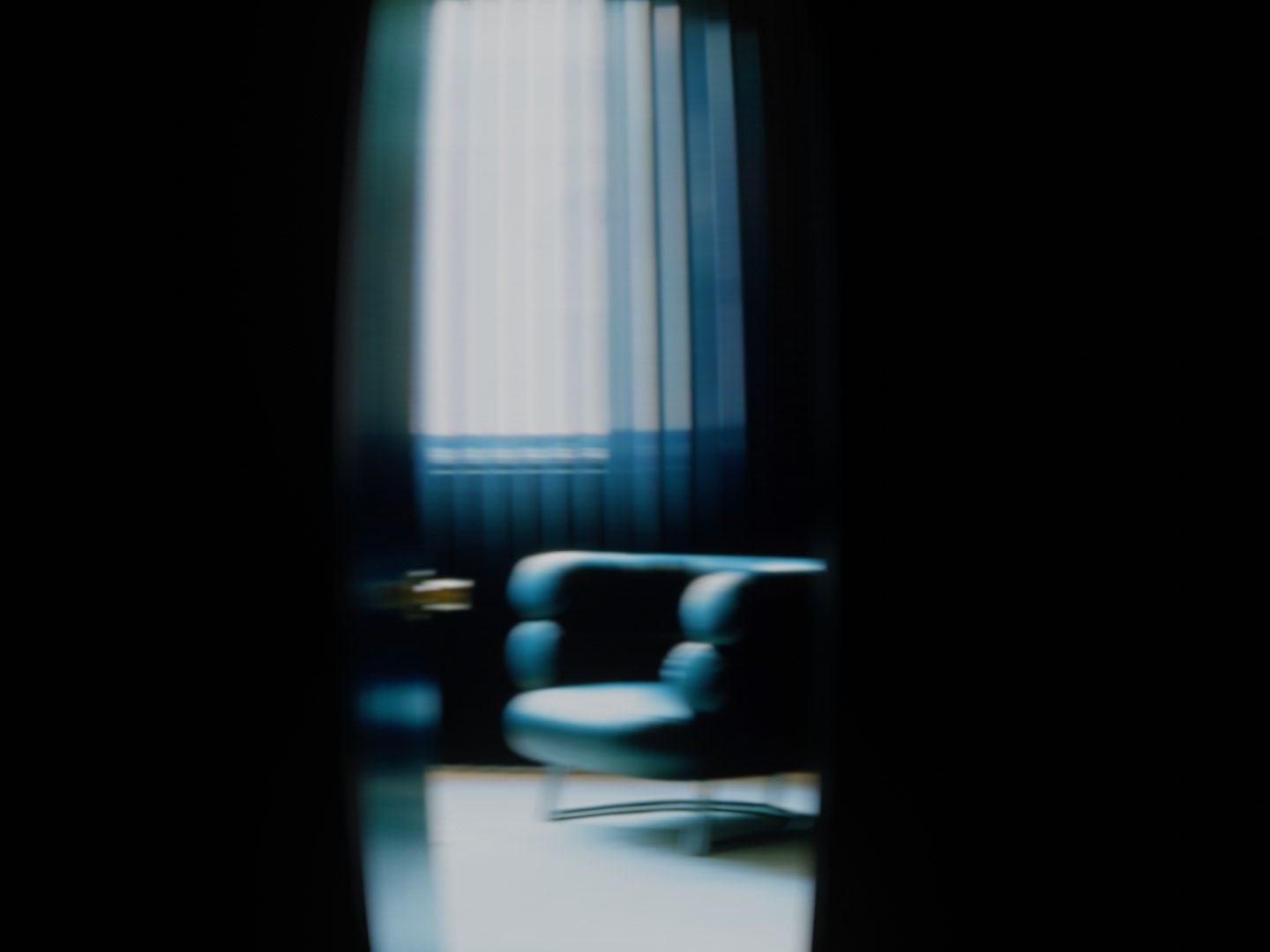 A blurry picture of a modern interior in a dark blue light